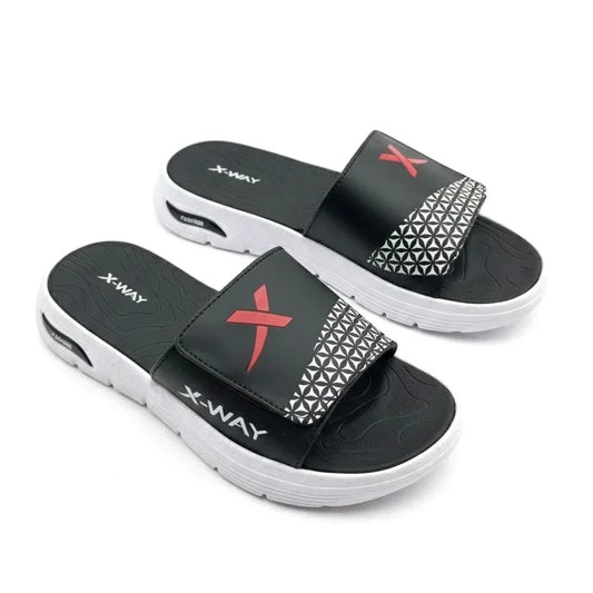 Black and white indoor slide sandals with red X design and geometric pattern, cushioned sole
