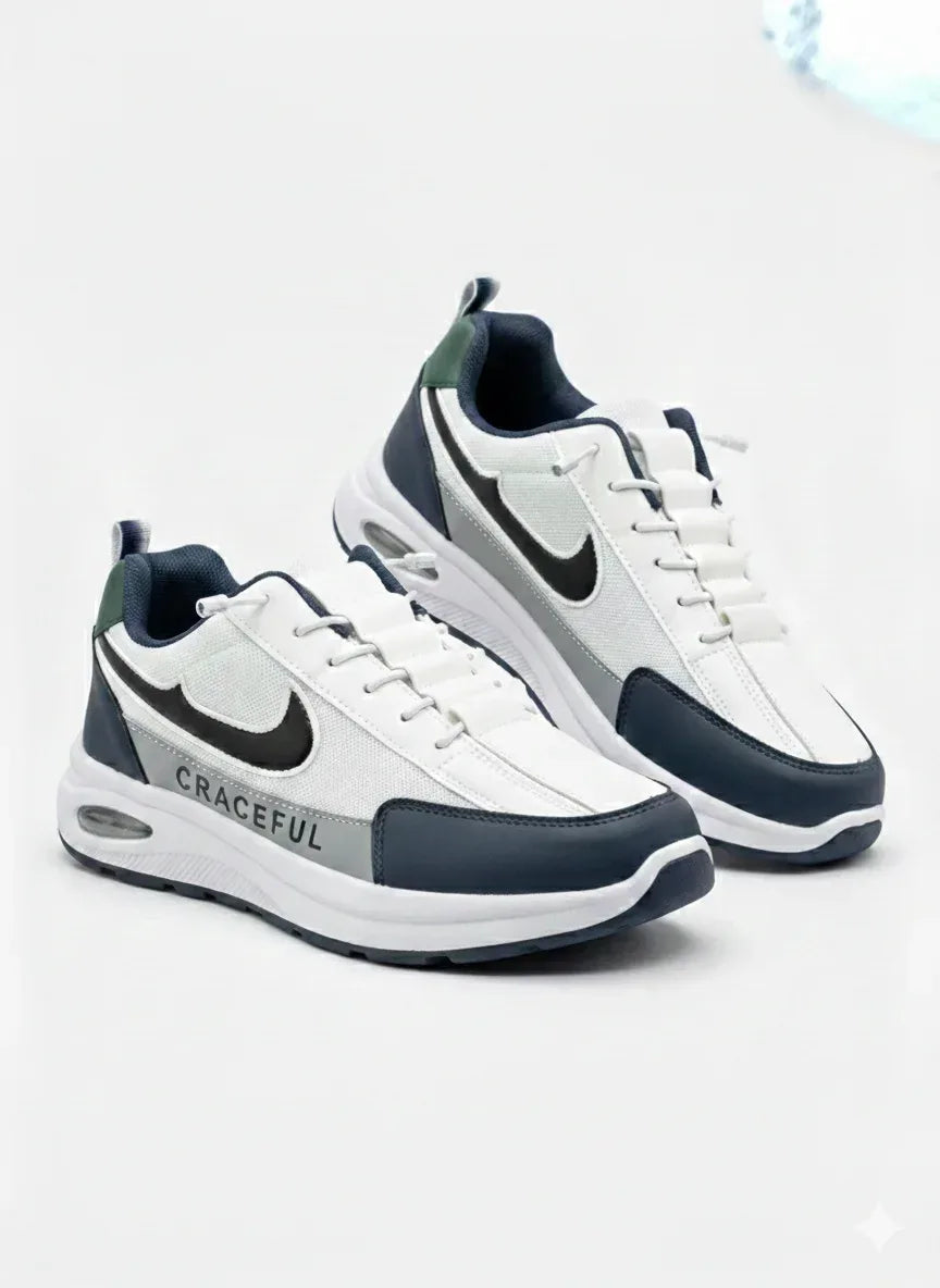 White and navy blue athletic sneakers with black swoosh and 'GRACEFUL' text on side.