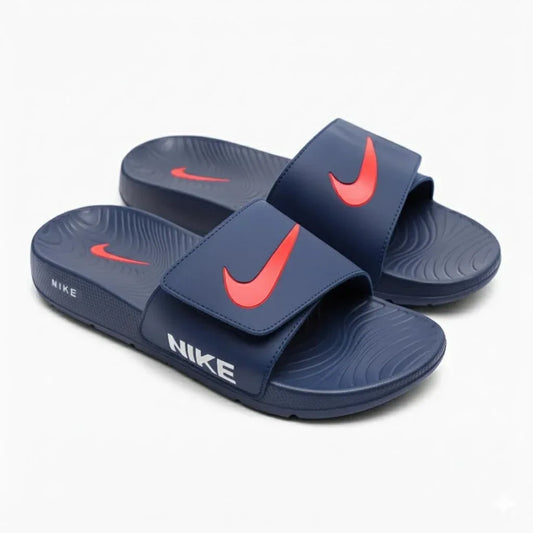 Pair of blue indoor adjustable slide sandals with red accents and textured soles